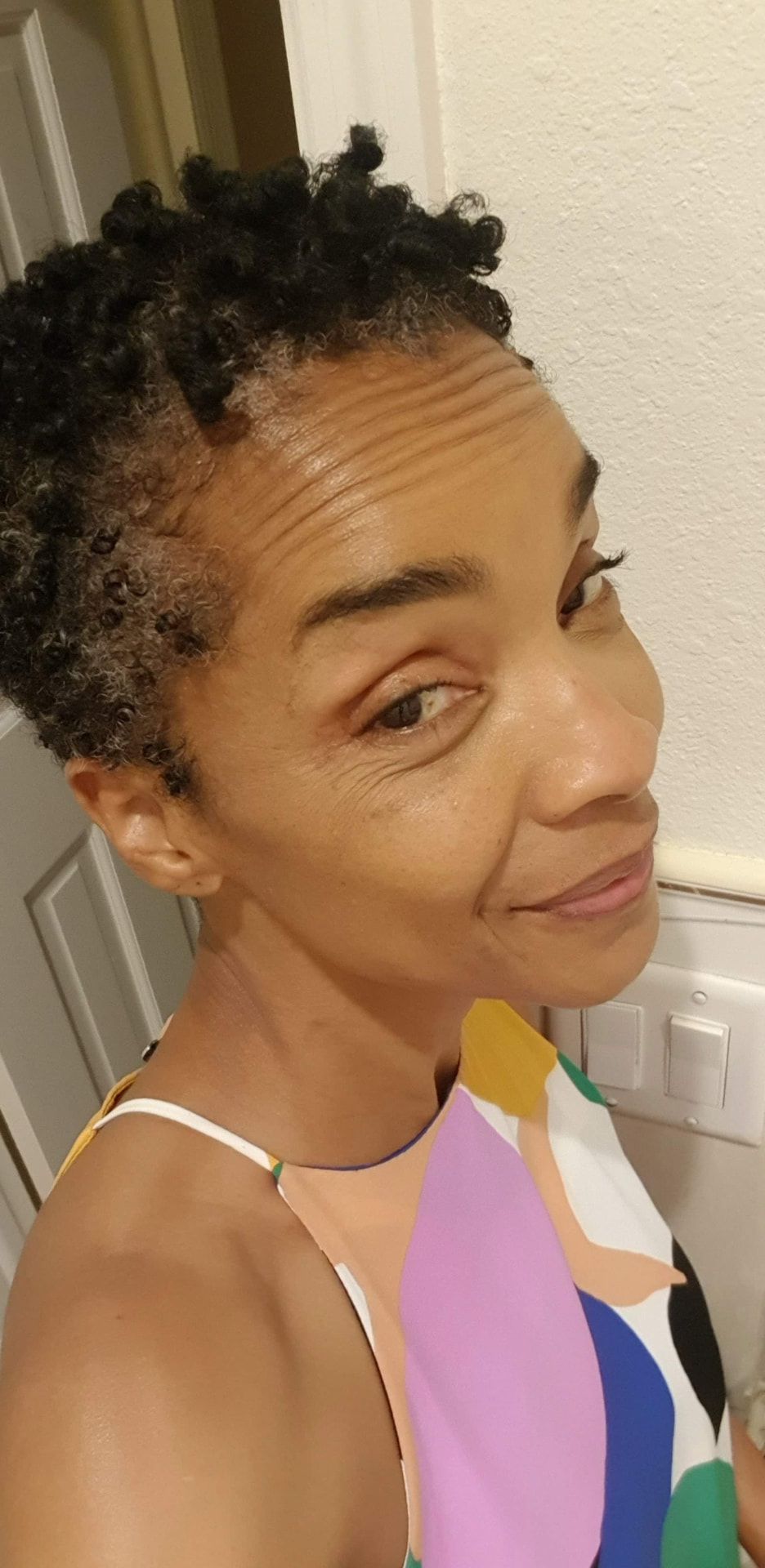 Anjanette Saint with short natural curls, October 2021