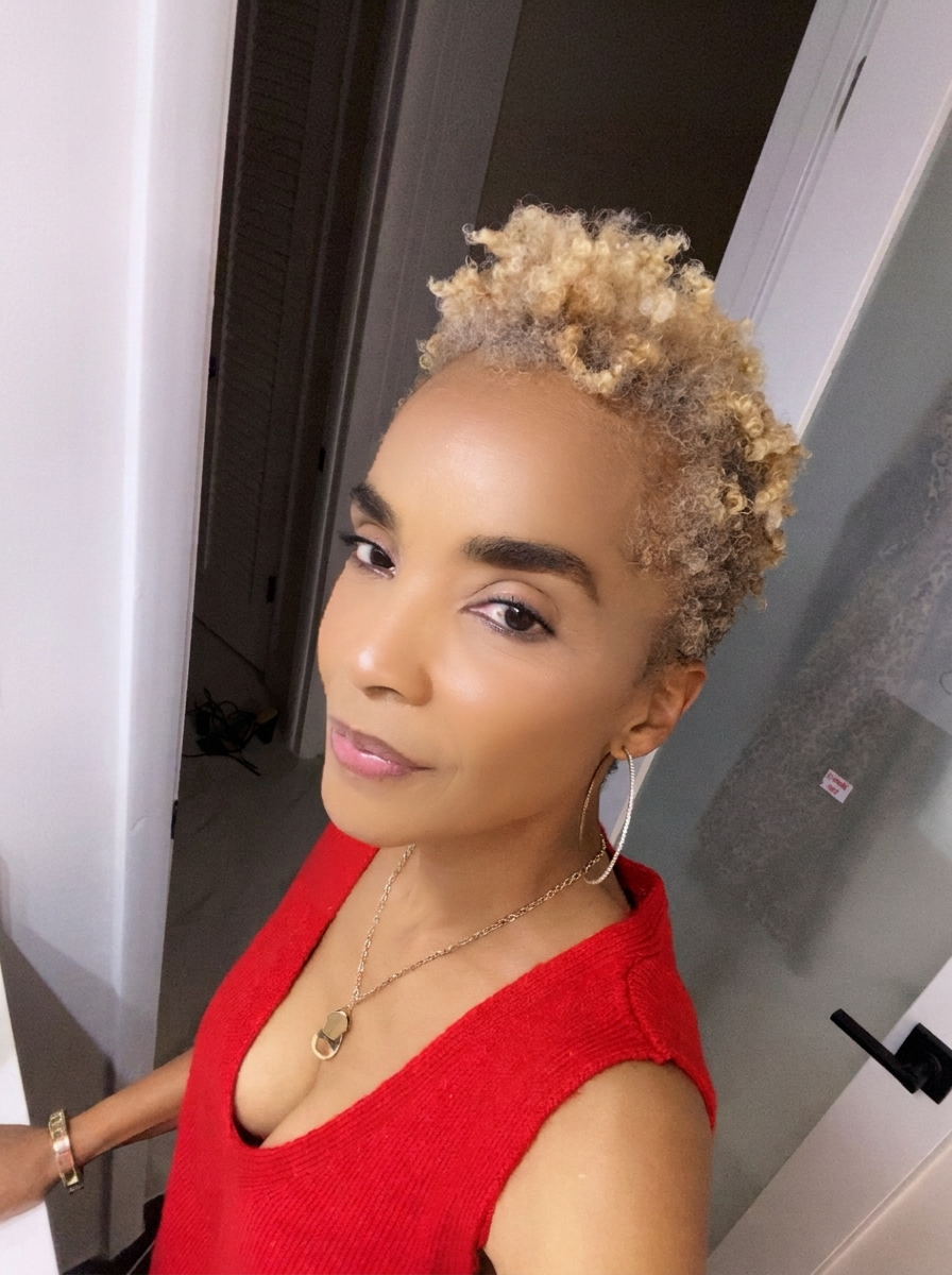 Anjanette in November 2023 with fuller, curly regrown hair